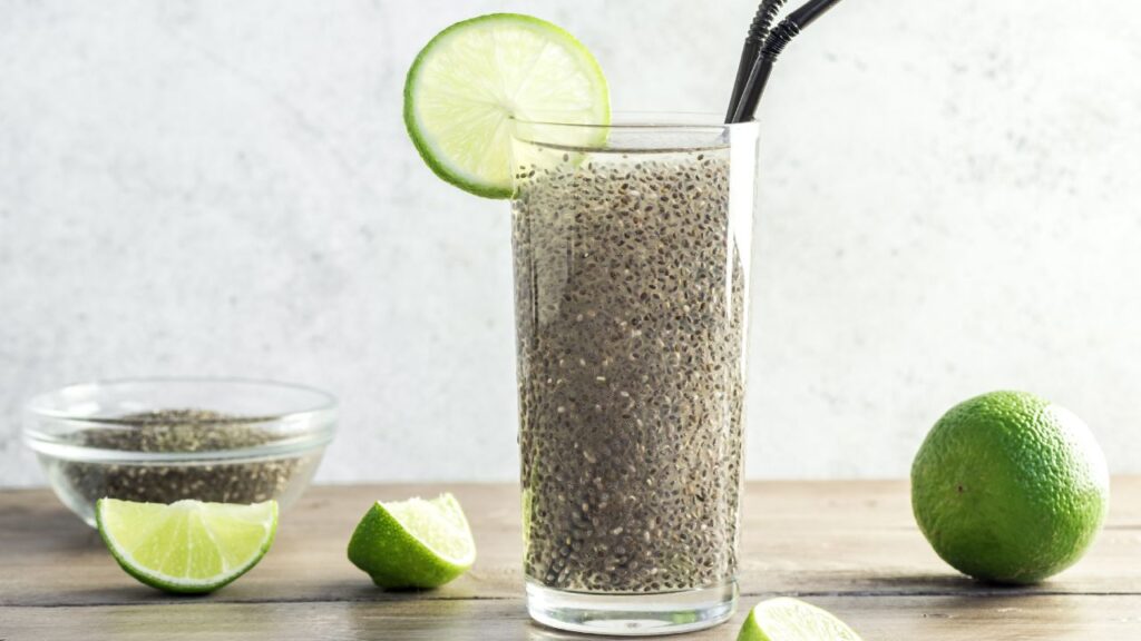 Glass of chia seed water with lime, a refreshing and hydrating superfood drink for fertility and overall health.