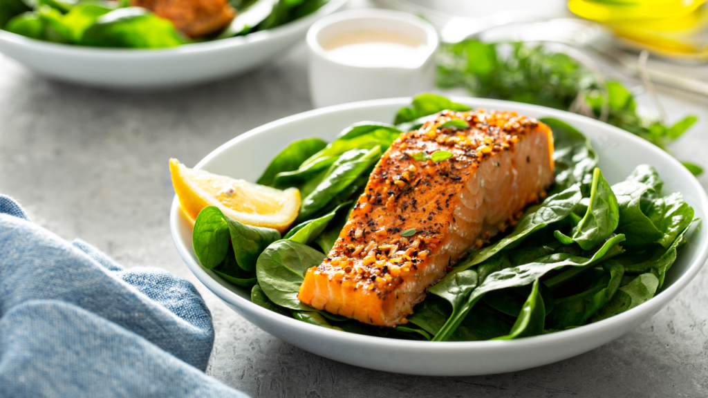 Mediterranean Za’atar Salmon served on a bed of fresh spinach with a wedge of lemon. A nutrient-rich dish packed with CoQ10, vitamin D, and vitamin A—key nutrients for sperm health and male fertility